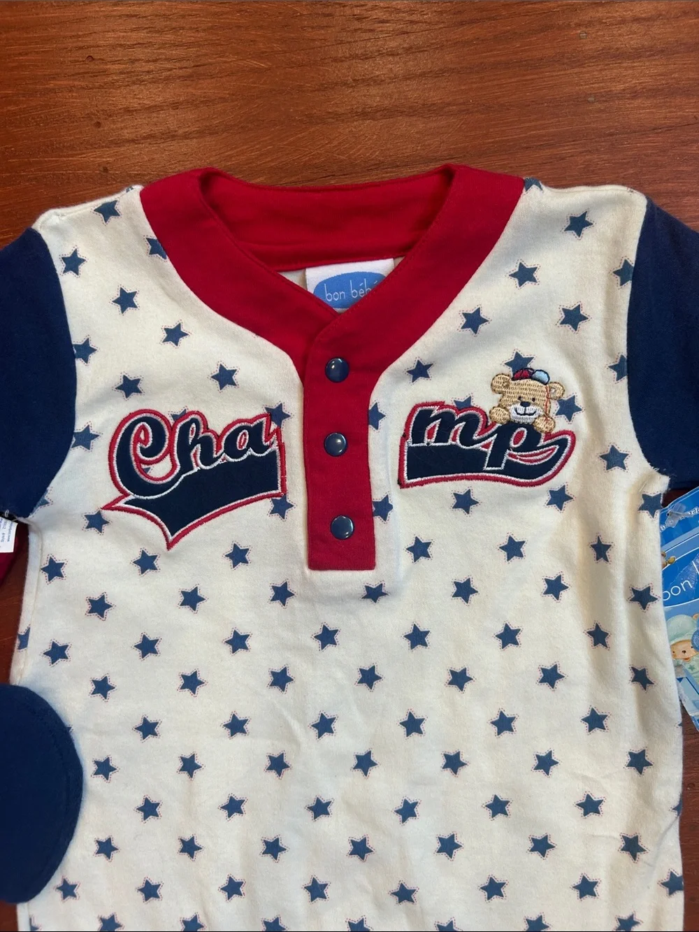 Bon Bebe Cream One-Piece with Navy Stars and Red Trim